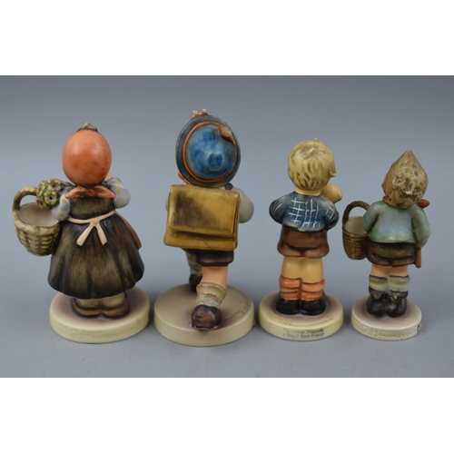 81 - Selection of four Goebel Hummel Figures to include A Boys Best Friend, Village Boy, on Holiday and S... 