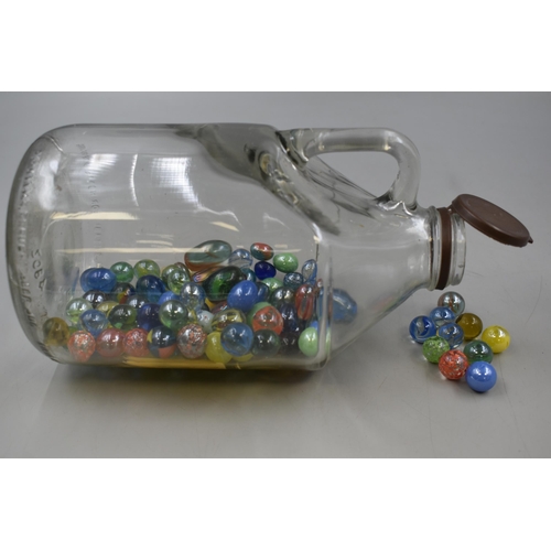 142 - A Selection of Glass Marbles, In A Greenall's Beer Jug.