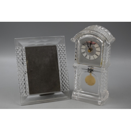 149 - A Crystal Quartz Clock, With A Crystal Picture Frame. Clock is Approx 20cm Tall.