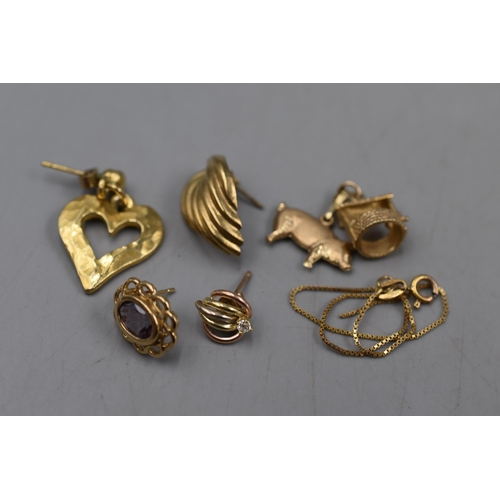 5 - A Selection of Scrap 9ct Gold Pieces. Includes Charm, Earrings and Other. (5.29 grams)