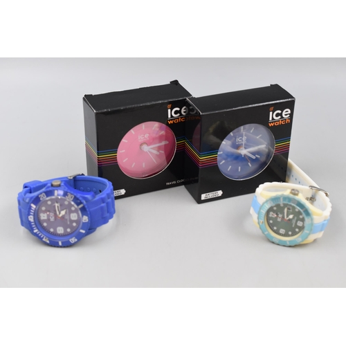 64 - Two Ice Travel Clocks and two Wrist Watches with Rubberised Straps (All Working)