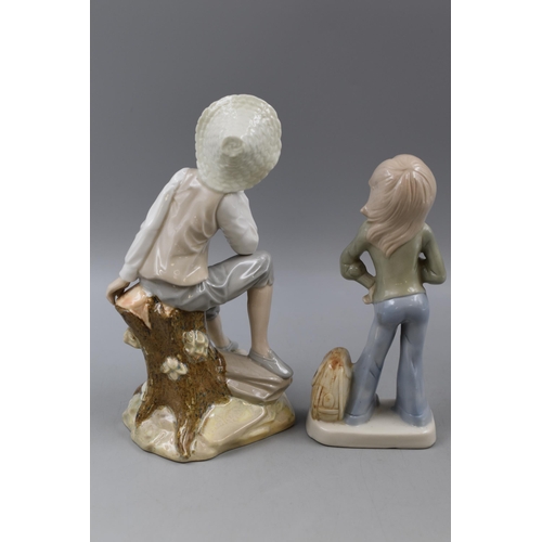 214 - Two Decorative Porcelain Statues of a Seated Boy and a Girl one branded Tengra largest 9