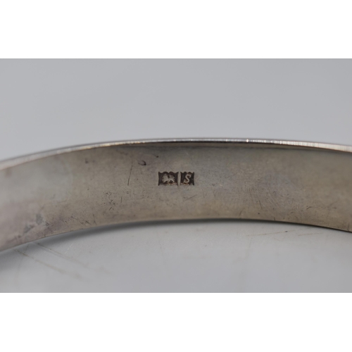 43 - A Hallmarked Birmingham Etched Silver Bangle With Safety Chain.