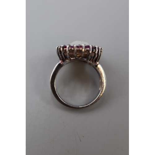 44 - A 925. Silver Ring. With Pink Stones and Central Opalesque Stone.