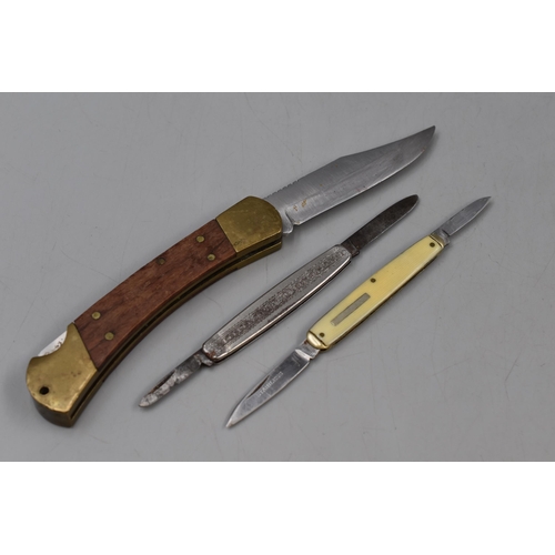 196 - Collection of Three Pocket Knives, one Campino with Brass/Wood Handle