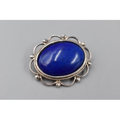 56 - A Silver 925. Brooch With Large Central Blue Stone.