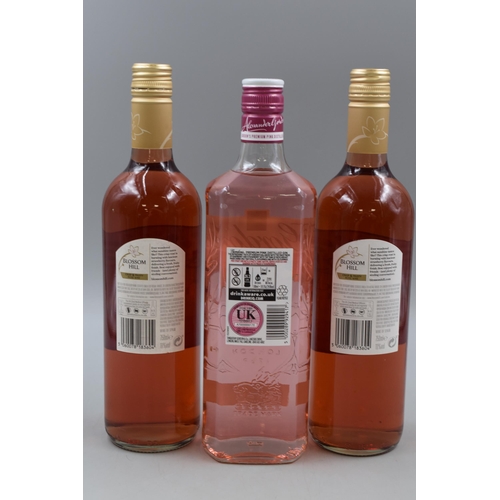 128 - Bottle of Gordons Pink Gin and two Bottles of Blossom Hill Rose Wine (Sealed)