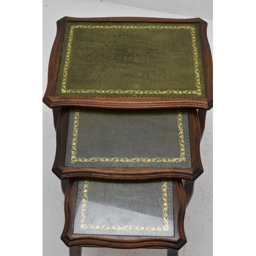 634 - A Nest of Three Green Leather Inlaid Tables, One Missing Glass Top. Approx 22