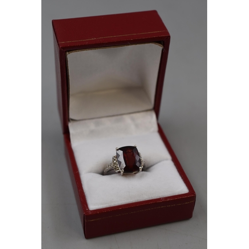 57 - White Gold 375 (9ct) Large Ruby Stoned Ring (Size O) Complete with presentation box