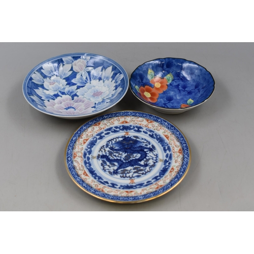 338 - A Mixed Selection of Oriental Style Ceramic Pieces.