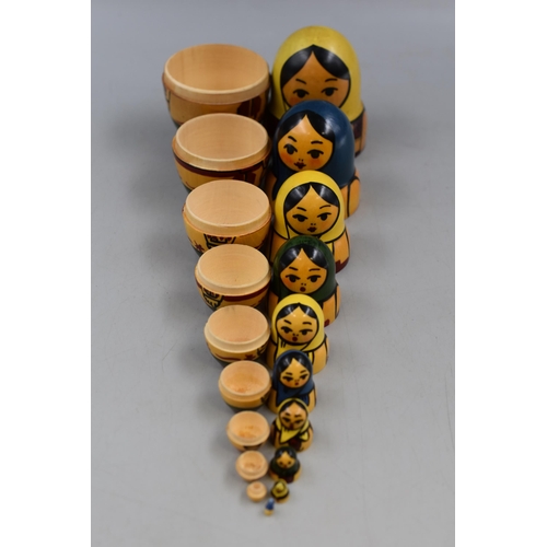 153 - Ten Piece Russian Doll Set Hand Painted in wood