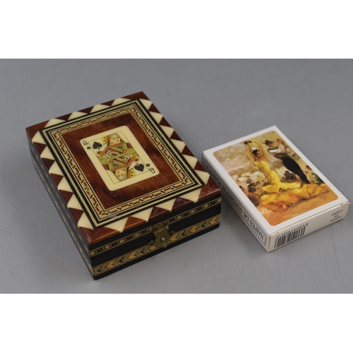 181 - An Inlaid Wooden Playing Cards Box, With Spanish Themed Playing Cards.