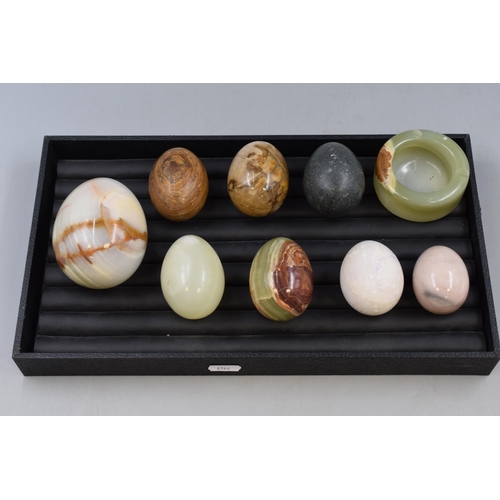 434 - A Tray Containing Eight Onyx Eggs and An Onyx Ashtray.