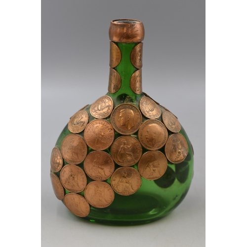 195 - A Green Glass Jug, Decorated With Copper Coins. With Spare Coins.