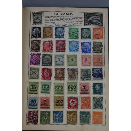 452 - The Movaleaf Illustrated Loose Stamp Album containing a large selection of Worldwide Stamps includin... 