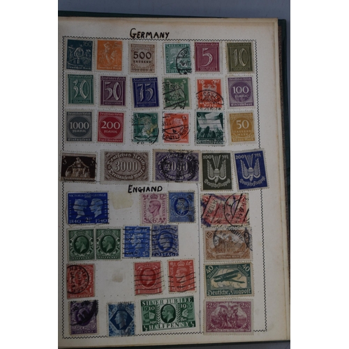 452 - The Movaleaf Illustrated Loose Stamp Album containing a large selection of Worldwide Stamps includin... 