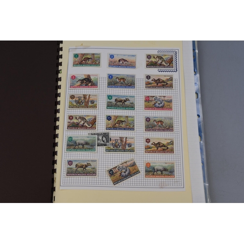 456 - Stamp Album containing a Selection of Definitive and Pictorial Stamps including UK, Malaya, Sarawak,... 