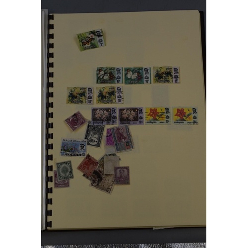 456 - Stamp Album containing a Selection of Definitive and Pictorial Stamps including UK, Malaya, Sarawak,... 