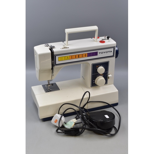 467 - A Retro Toyota 2201 Electric Sewing Machine, Powers on When Tested.