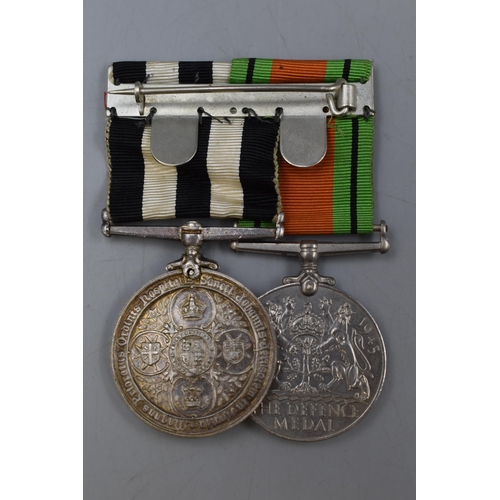 204 - Set of Two WWII Medals to include Defence Medal and Service Medal for the Service of St John