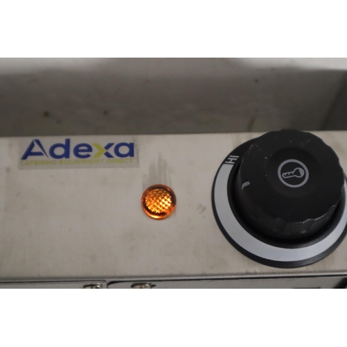 515 - Adexa Direct Limited Hanging Strip Food Warmer 500W. (Needs chains for hanging). Powers on