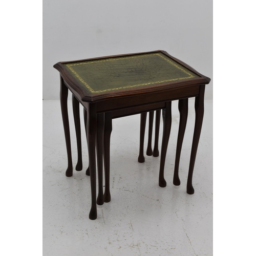 547 - A Nest of Three Green Leather Inlaid Tables, One Missing Glass Top. Approx 22