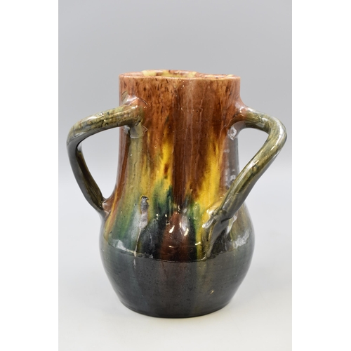 275 - A Studio Pottery Three Handled Drip Effect Vase. Approx 9.5