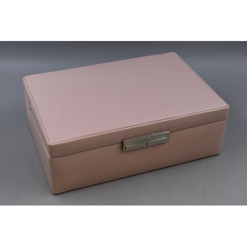 438 - A Pink Leather Effect Jewellery Box, With Mirror and Key. Approx 8.5