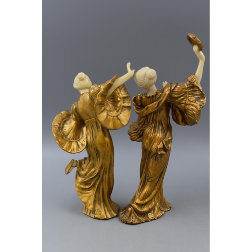 196 - Pair of Gold Coloured Dancing Ladies, Largest approx 11