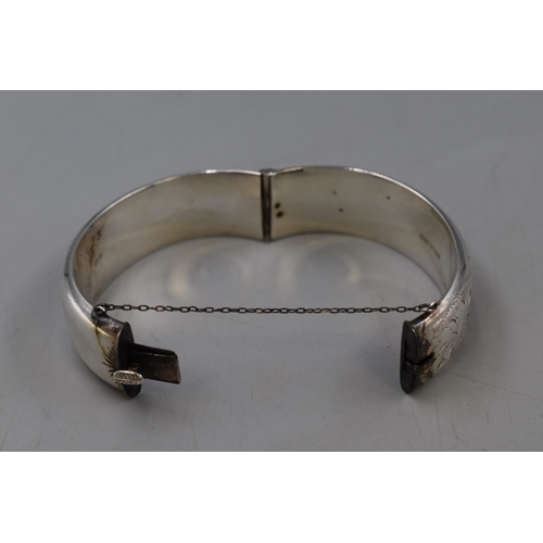 31 - Hallmarked Birmingham Silver etched bangle complete with safety chain