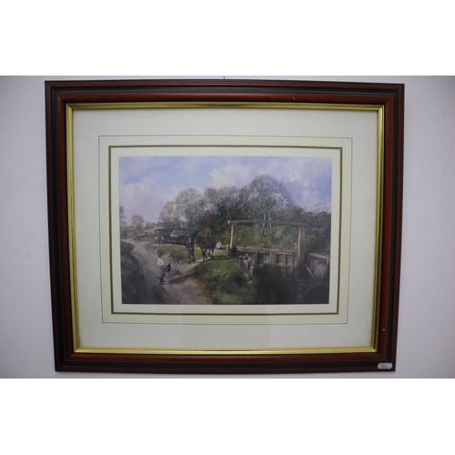 385 - Two matching framed and glazed prints depicting countryside scenes (60cm x 50cm)