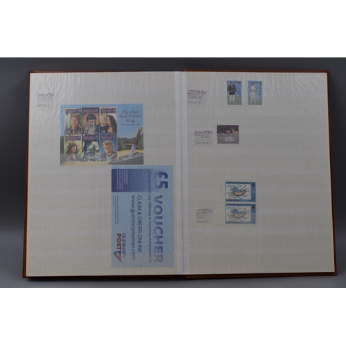 483 - Two Stock Albums Containing a selection of Guernsey definitives, commemoratives and special stamps