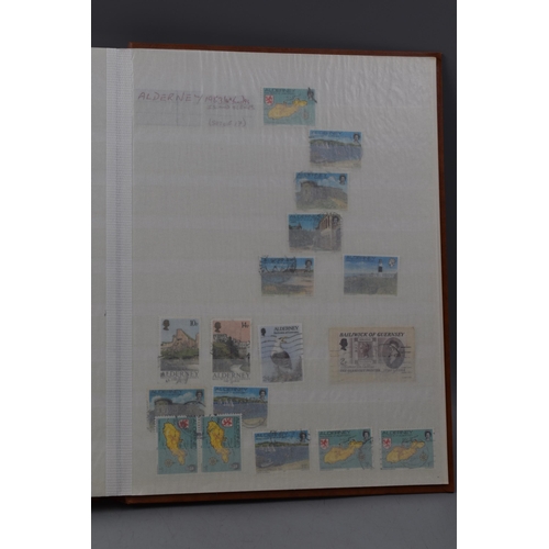 483 - Two Stock Albums Containing a selection of Guernsey definitives, commemoratives and special stamps