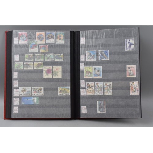 485 - Three Stock Albums containing New Zealand definitives, commemoratives and special stamps