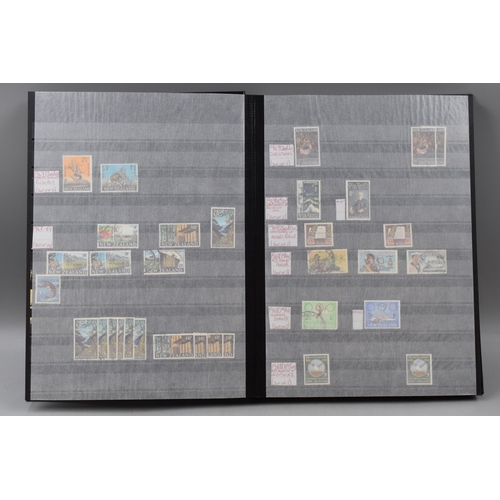 485 - Three Stock Albums containing New Zealand definitives, commemoratives and special stamps