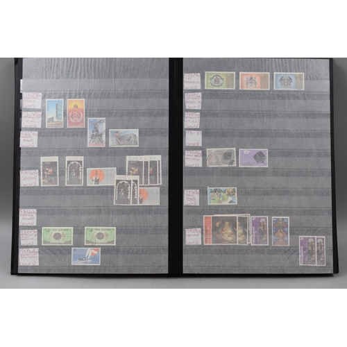 485 - Three Stock Albums containing New Zealand definitives, commemoratives and special stamps