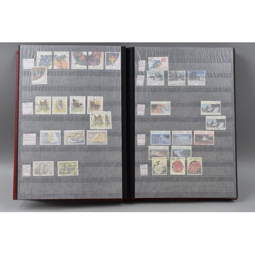 485 - Three Stock Albums containing New Zealand definitives, commemoratives and special stamps