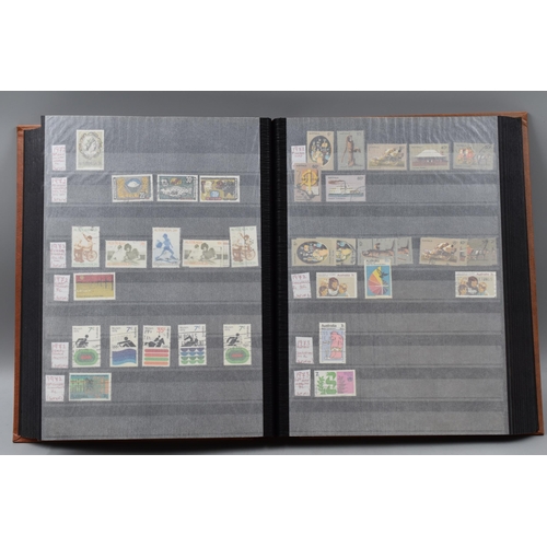 486 - Stock Book Containing a selection of Australian definitives, commemoratives and special stamps datin... 