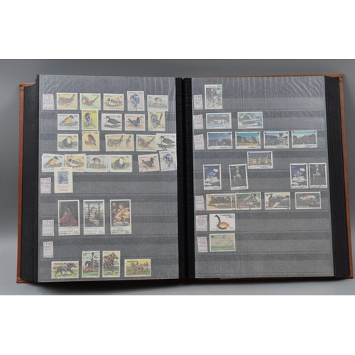 486 - Stock Book Containing a selection of Australian definitives, commemoratives and special stamps datin... 