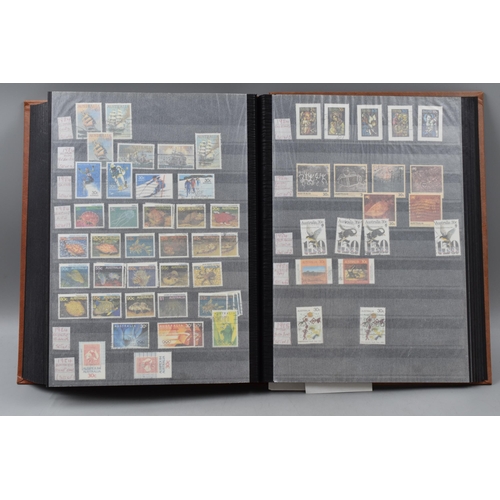 486 - Stock Book Containing a selection of Australian definitives, commemoratives and special stamps datin... 