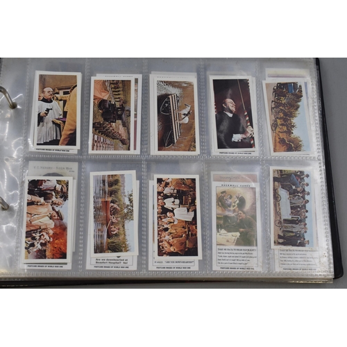 496 - A Folder Containing a Large Selection of Cigarette and Tea Cards. Includes Wills, Players, Taddy & C... 