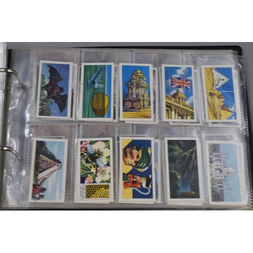 496 - A Folder Containing a Large Selection of Cigarette and Tea Cards. Includes Wills, Players, Taddy & C... 