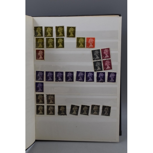 506 - Stock Album Containing a large selection of Mach In Head Difinitive Elizabeth II Stamps