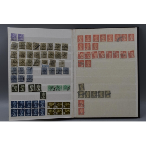 506 - Stock Album Containing a large selection of Mach In Head Difinitive Elizabeth II Stamps