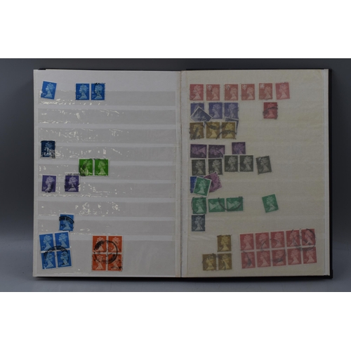 506 - Stock Album Containing a large selection of Mach In Head Difinitive Elizabeth II Stamps