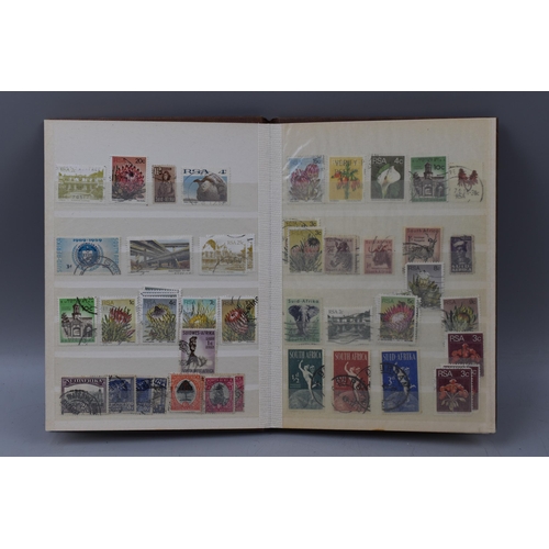 508 - Three Stock Albums Containing Mixed Stamps From South Africa, Ceylon and More