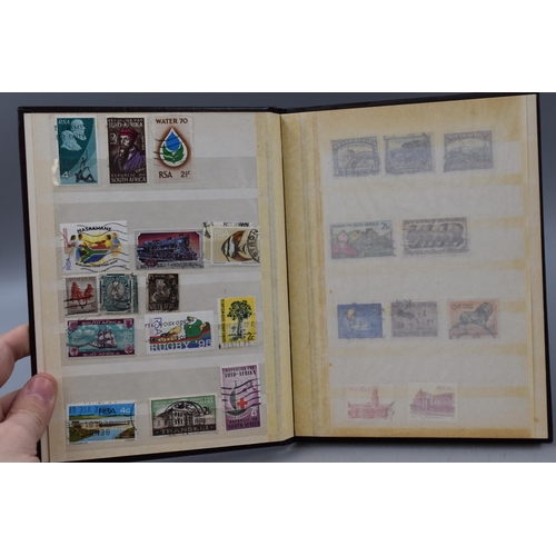 509 - Three Stock Albums Containing Stamps From South Africa, Monaco, and Cyprus