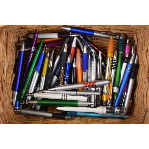 533 - A Wicker Basket Containing a Selection of 50 Assorted Pens.