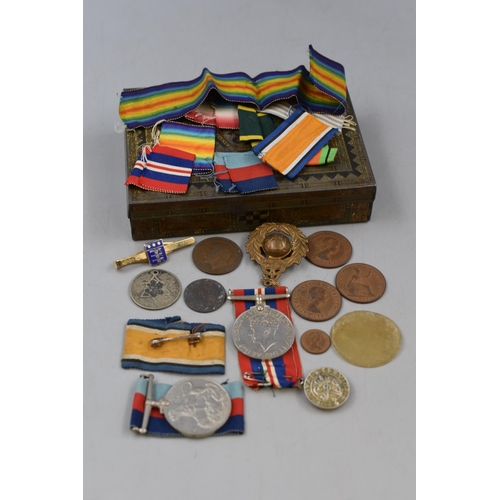 209 - A Vintage Tin Containing a Selection of Military Medals, Coins and More.