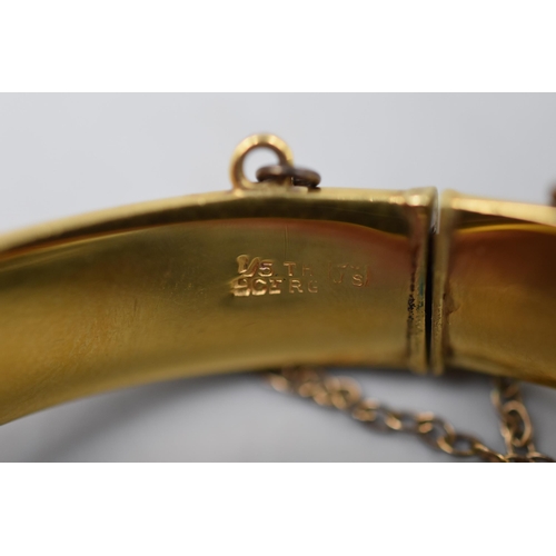 144 - A 9ct Rolled Gold Etched Bangle With Safety Chain.